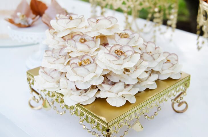 Decorative Desserts In White And Gold Paper Flowers