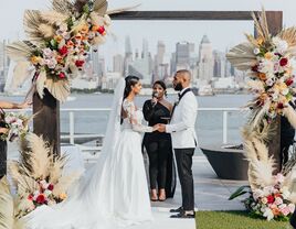 wedding ceremony with new york city backdrop