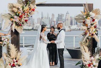 wedding ceremony with new york city backdrop