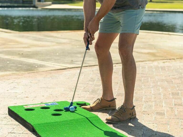 Husband playing putting golf game