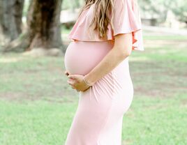 Pregnant woman in a pink dress