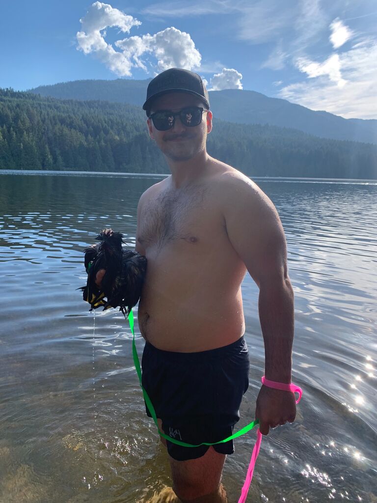 Aiden and his pet Rooster in the lake
