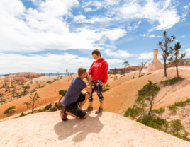 Man proposin to woman at canyon in Utah