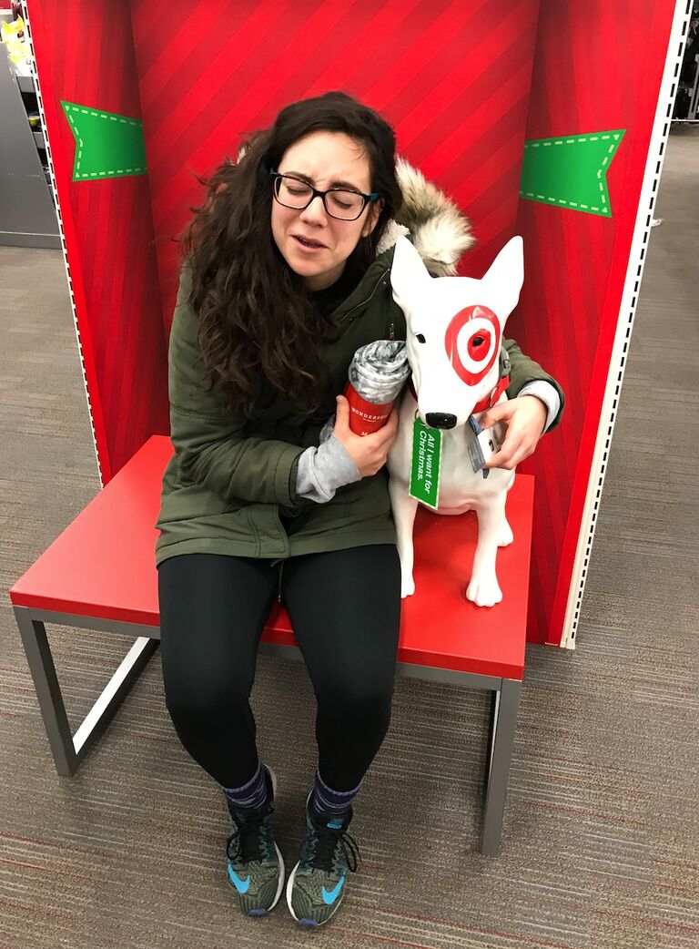This was taken at Target around 5am on Black Friday after our second Thanksgiving together. Neither of us are big Black Friday shoppers, but we wanted to do it once for fun. Alexa HAD to get a commemorative picture with the Target dog, but she bonked her head on its ear as she leaned in. This photo captures her moment of anguish.
