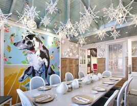 Modern event space with funky light fixtures and colorful artwork. 