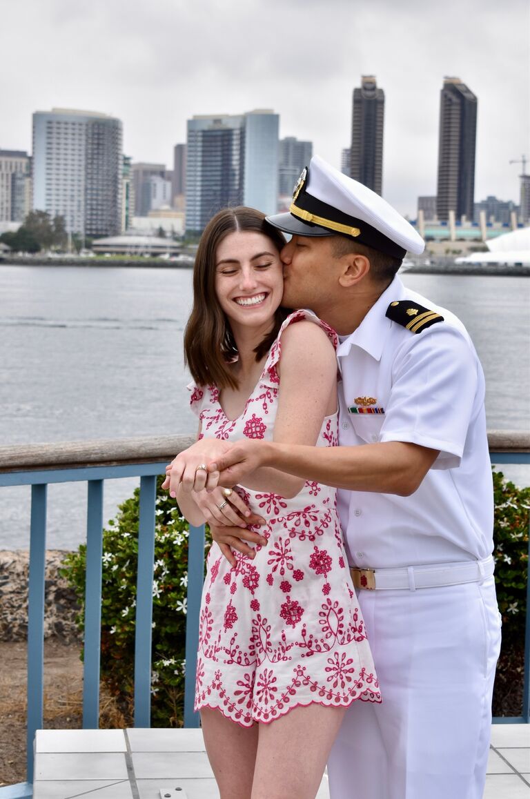 Under the guise of a fake brunch, Gabe popped the question in scenic Coronado. Coming up with an excuse to wear his uniform was challenging. He decided that his advisor, Dr. Johnson, would be hosting the fake brunch - she was a stickler for uniforms.