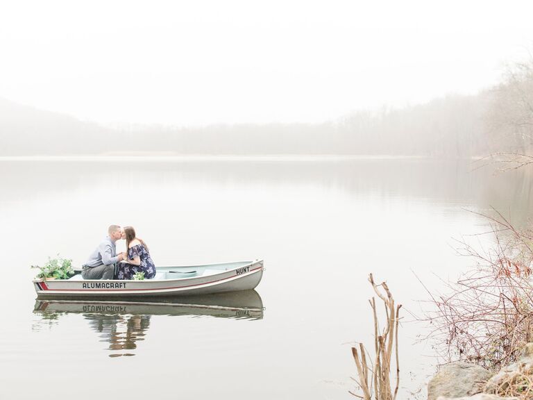 engagement photo shoot in a small boat on a lake