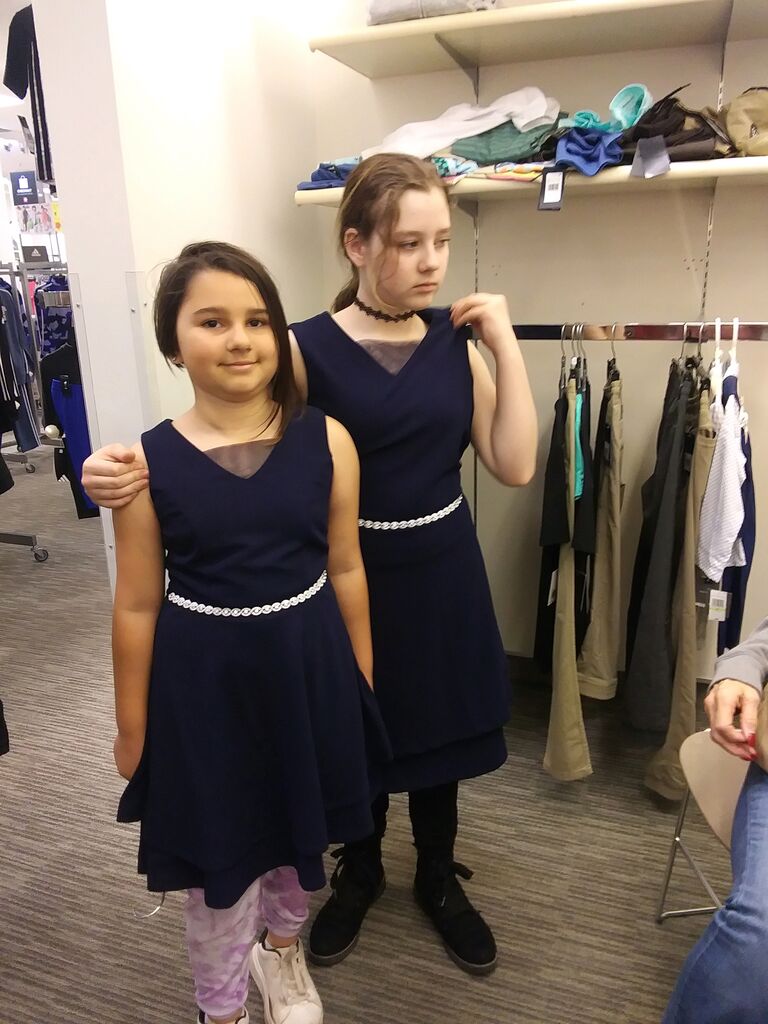 Amanda goes dress shopping with her flower girls.