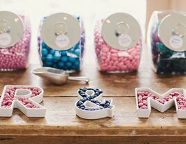 Monogram candy bowls at wedding reception