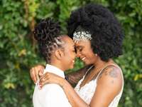 Black LGBTQ+ couple sharing hug