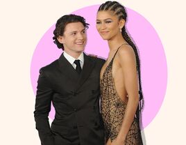 Photo of Tom Holland looking lovingly at girlfriend Zendaya. 