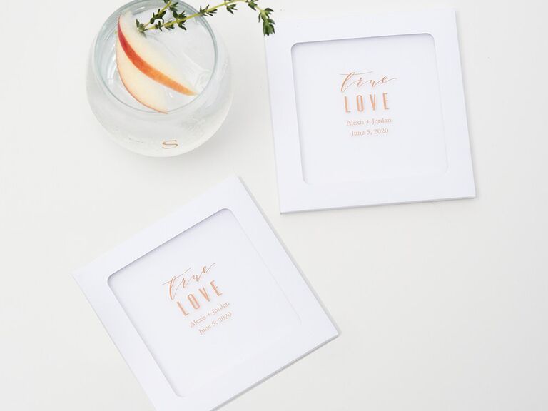 White square glass coasters with 'true love' and couple's names and date in minimalist gold type