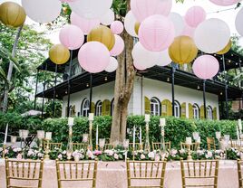 Wedding venue decorated with lanterns, tables adorned with candles