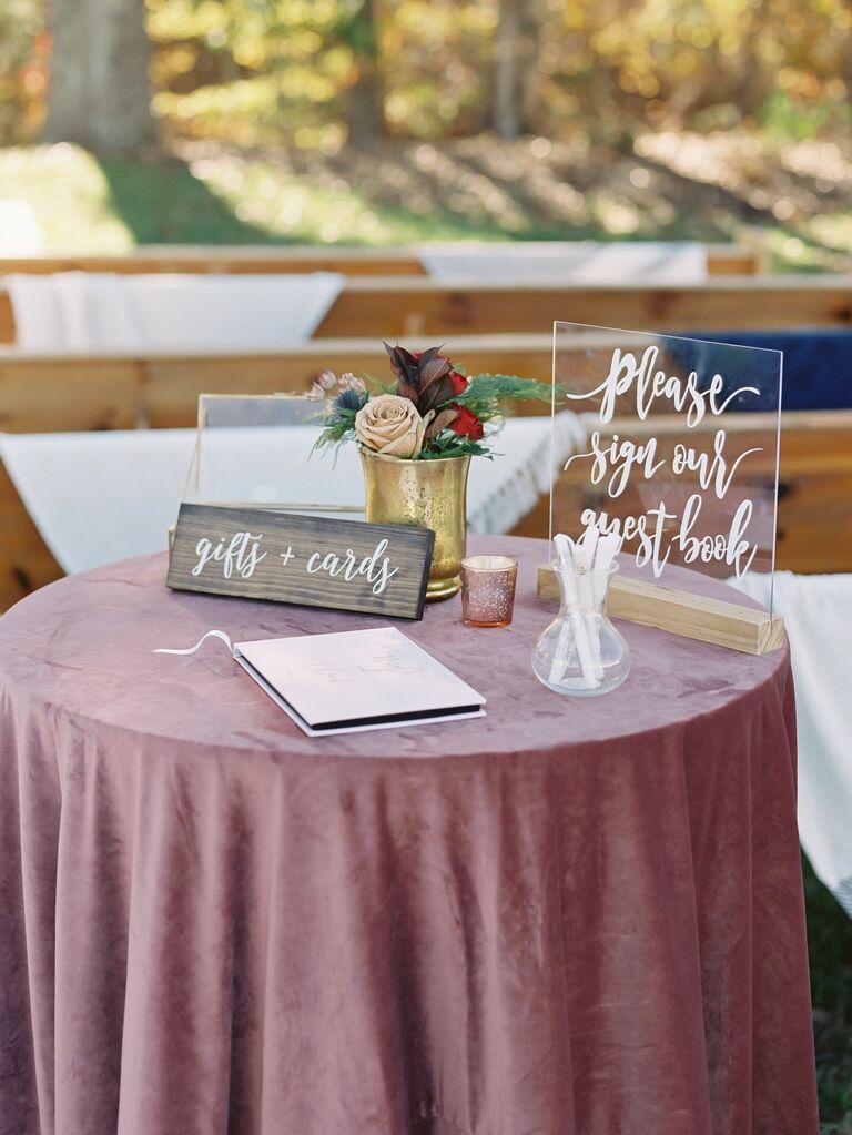 wedding gift table with mauve velvet tablecloth and acrylic signage