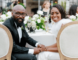 Bride and groom at wedding head table.