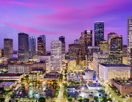 Downtown Houston skyline and purple sunset sky