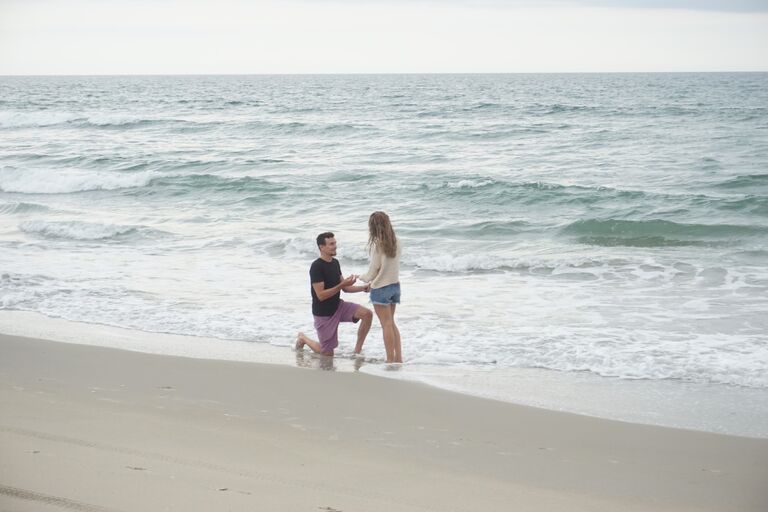 Erik and Jillian went to the Outerbanks, NC with a group of close friends. Erik asked Jillian to go for a walk on beach and popped the question, all while their friend was hiding to snap some pictures! After the proposal, their friends surprised them with an engagement party back at the house. It was a night to remember!