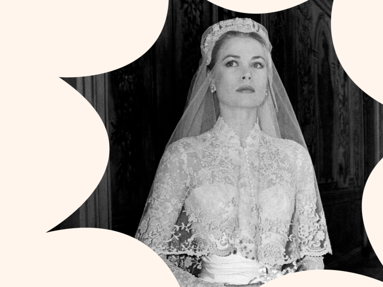 Grace Kelly wears a beautiful embroidered wedding veil. 