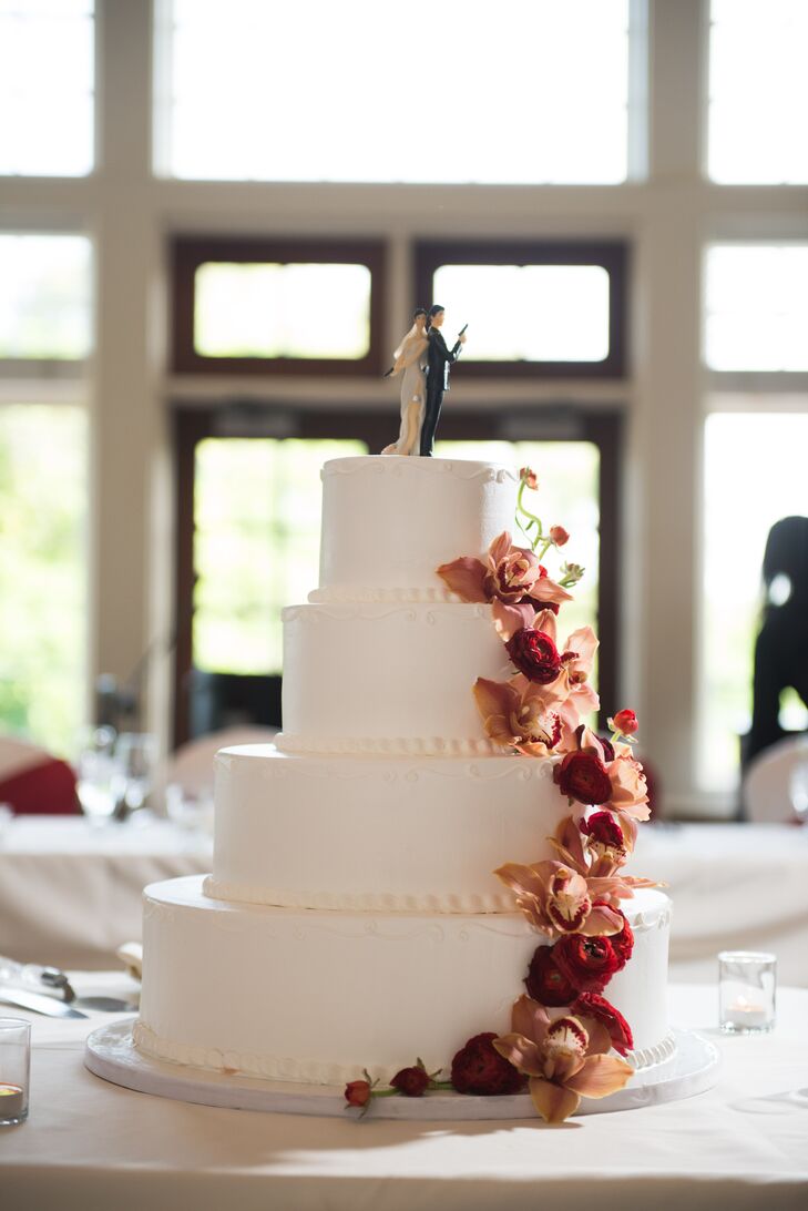 Four Layer Wedding Cake With Cascading Roses And Orchids