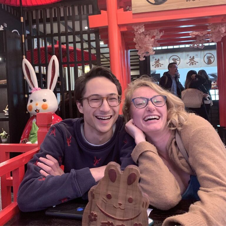 The second photo ever taken of Adam and Ella joyfully waiting for some dessert.