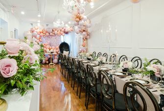 Beautiful intimate rehearsal dinner space with balloons and florals