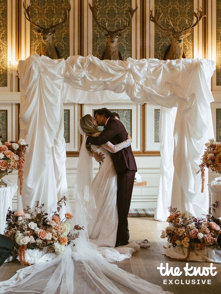 Logan Rae Hill and Joey Kurbanov kissing during their wedding ceremony