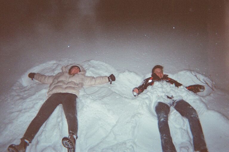 As the year ended we went on a walk with the group of friends. Mutually jumping into a snow bank somewhere along the way. Amieka's good friend Aryn captured this photo on a film camera. As the night continued we watched fireworks in town, played card games, and made many special memories. Many little flirtatious interactions between us occurred as we entered the new year.  Unbeknownst to us, this is where our love story started. 