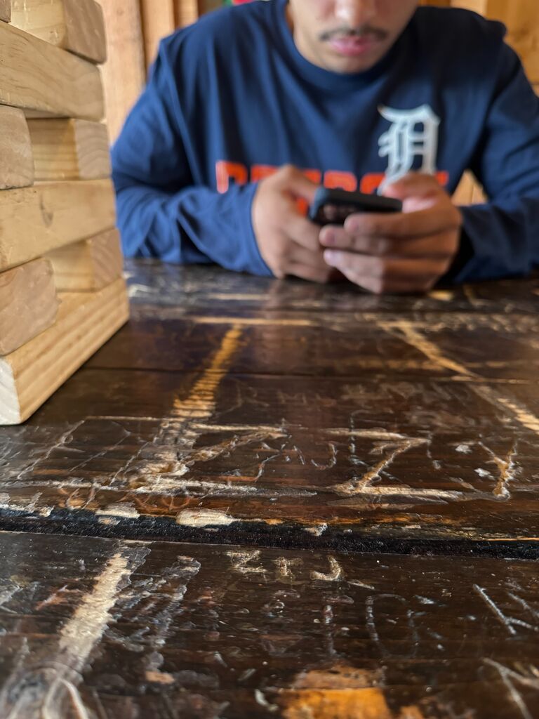 Had to carve our initials into the table at Green Dot Tavern 