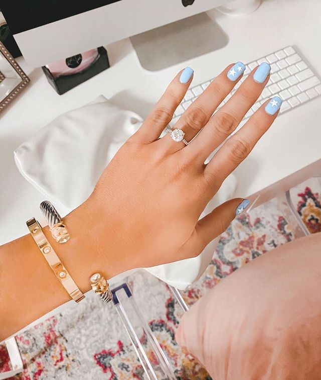 Engagement ring selfie above desk