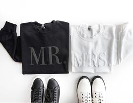 Mr. and Mrs. matching couples' sweatshirts in black and white. 