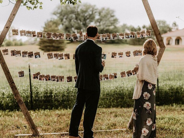 Interactive photo display at a backyard wedding