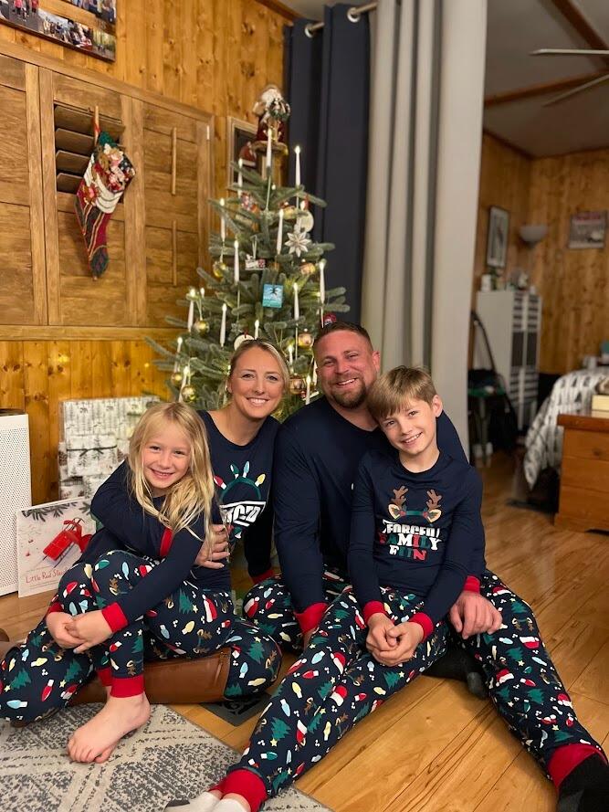 Annual family matching Christmas PJs photo - "Forced Family Fun!"