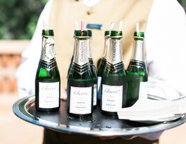 Waiter serving champagne bottles at a wedding