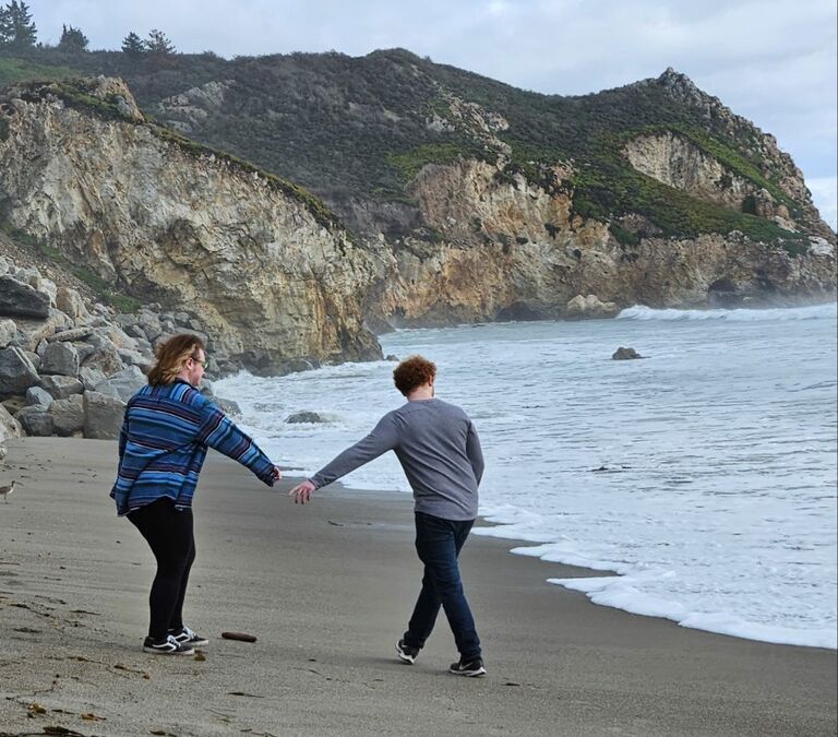 On a family trip to California! About five minutes after this picture, we both got stuck in a wave and our shoes, socks, and pants got soaked :(