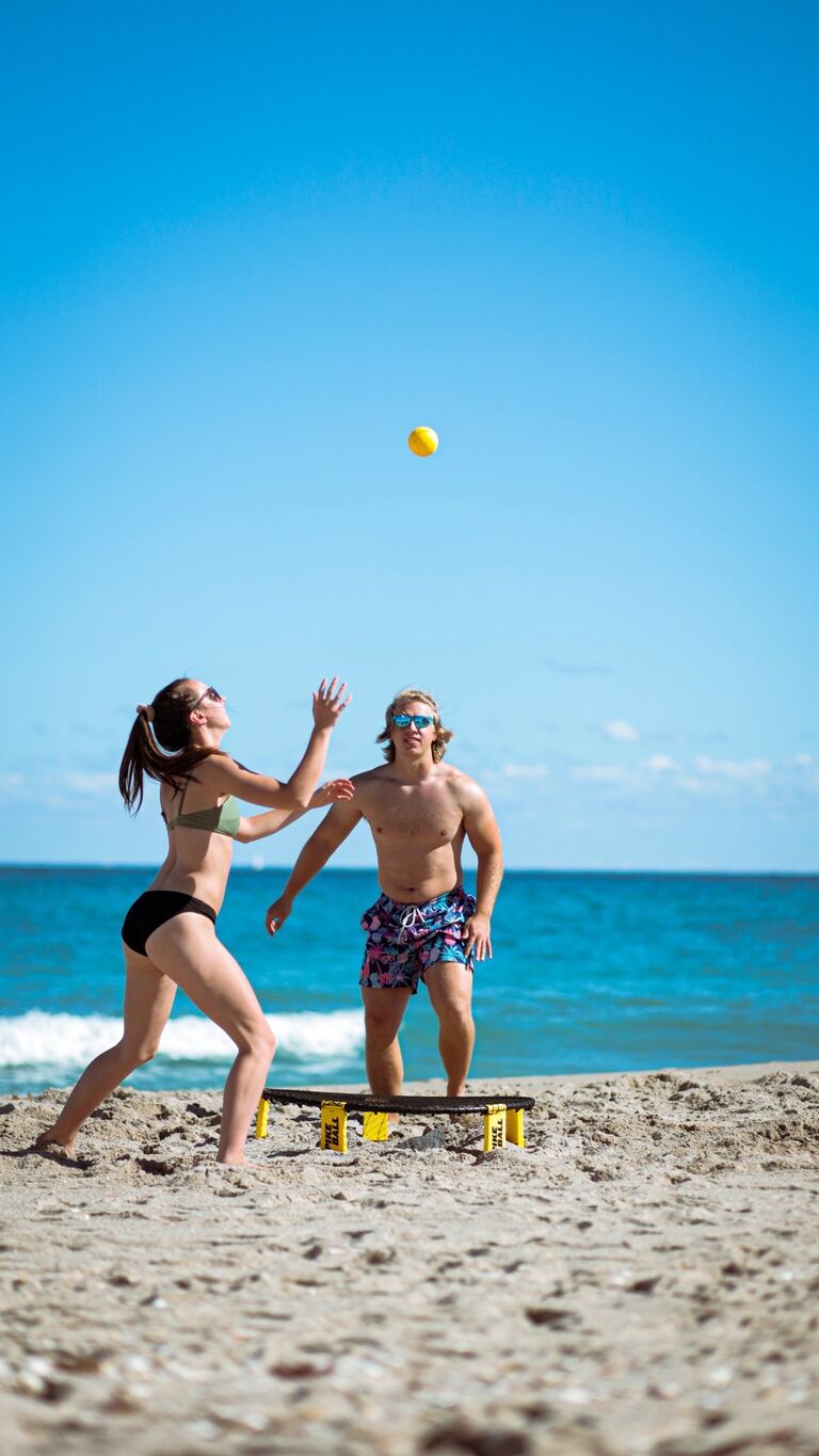 Vacation to West Palm Beach, FL. Spikeball is taken very seriously in this relationship.