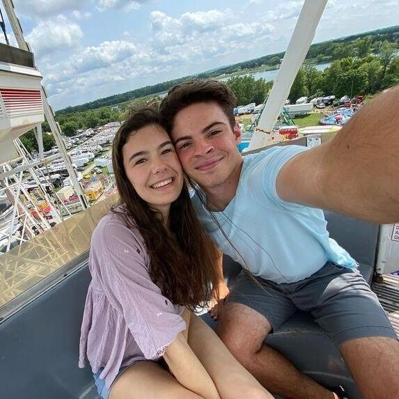 We went to the Elkhart County Fair together. I had this idea of how romantic it would be riding the ferris wheel. When we got on, we were told that we would have to sit across from each other in the car. When we got high enough, he scooched over next to me and got this picture. 