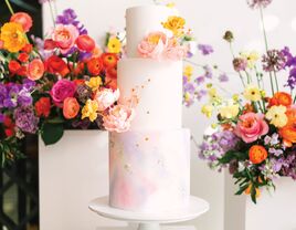 Watercolor wedding cake with floral accents