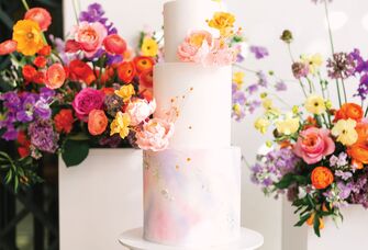 Watercolor wedding cake with floral accents