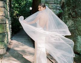 Bride twirling veil on wedding day