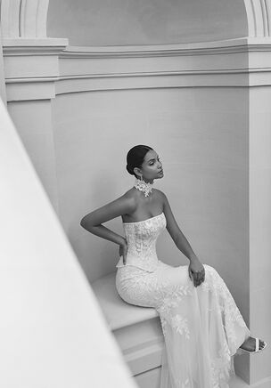 Two-piece mermaid silhouette wedding dress with strapless neckline, corset back. Made in lace with beadwork.