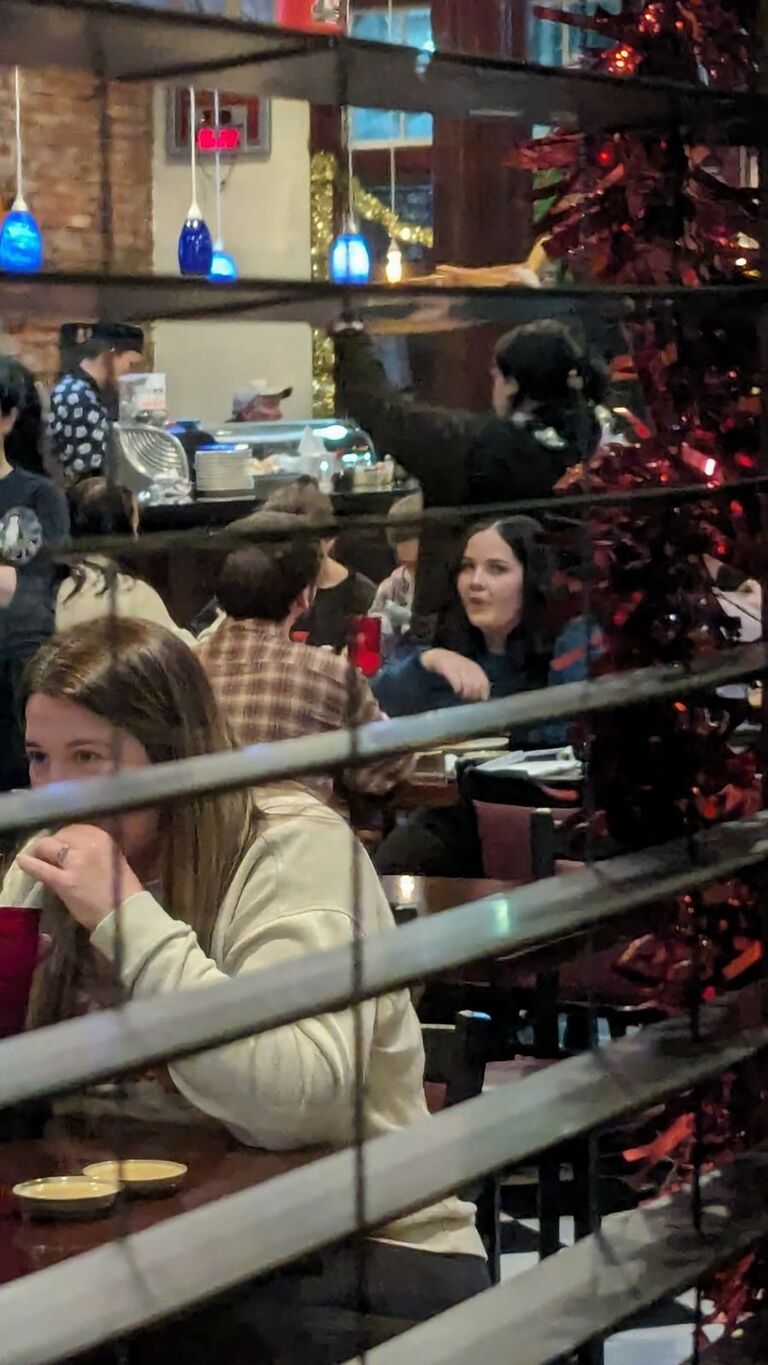 Lydia and Blake on their first date. Lydia's friends watched them from the window of the restaurant, just in case he was a creep from the internet. 