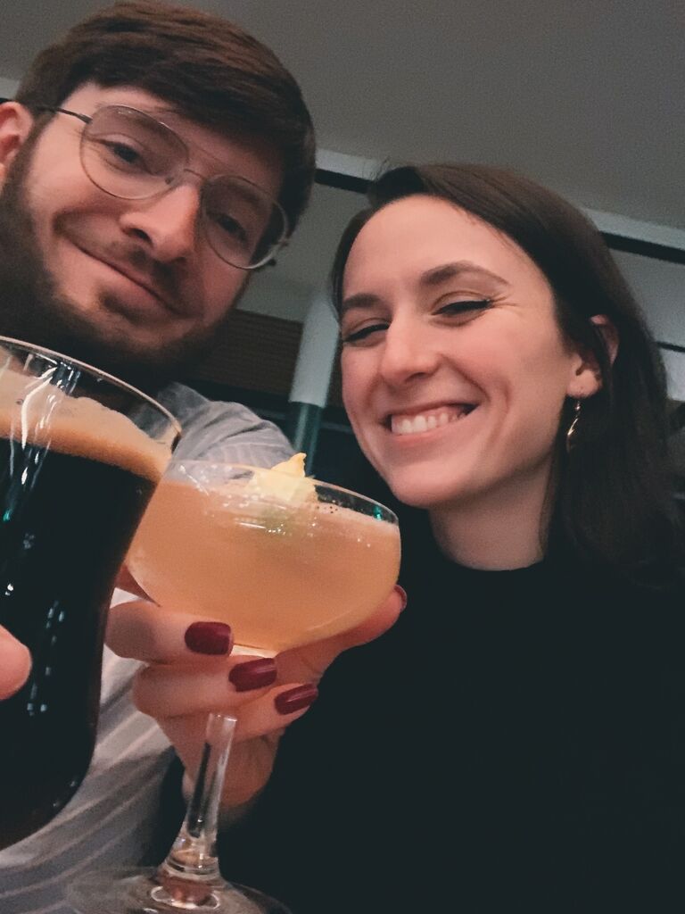 Enjoying a beer and craft cocktail at their favorite rooftop bar in Baltimore, MD.