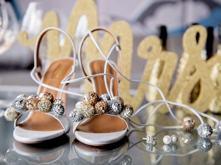 high heeled sandals with miniature gold and silver disco balls on the toe straps