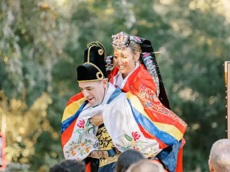 Groom Giving Bride a Piggyback Ride, Traditional During Korean Paebaek Ceremony