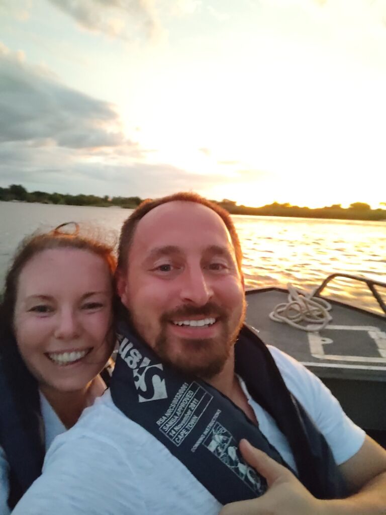 Motor boat along the Zambezi River to our private island getaway, Sindabezi Island Camp