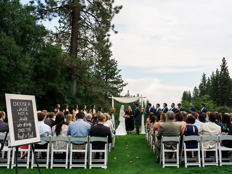 Happy couple exchanging their vows outside