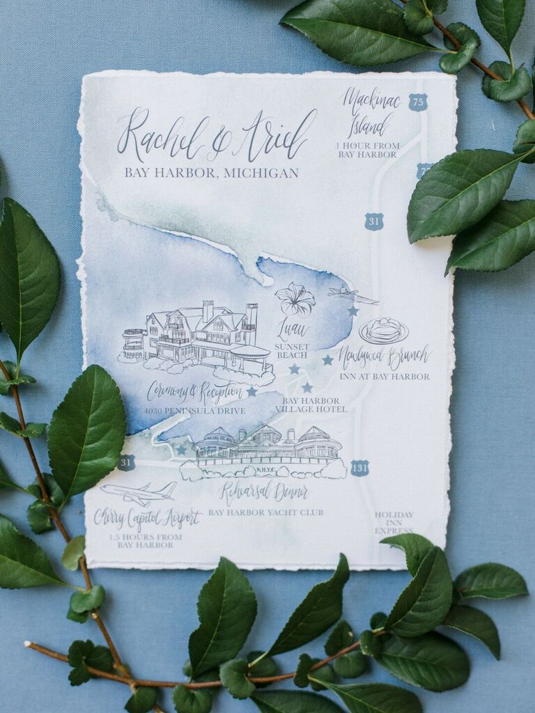 nautical wedding invitations with blue watercolor painted map of venue and couple's names in calligraphy