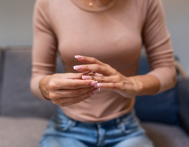 Woman taking off her engagement ring