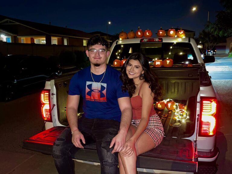 Carlos asked Dominique to be his girlfriend using pumpkins carved out with each letter.
