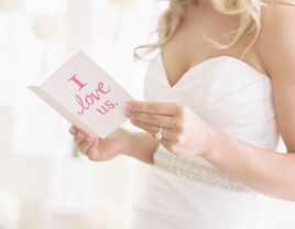 Bride reads a card on her wedding day